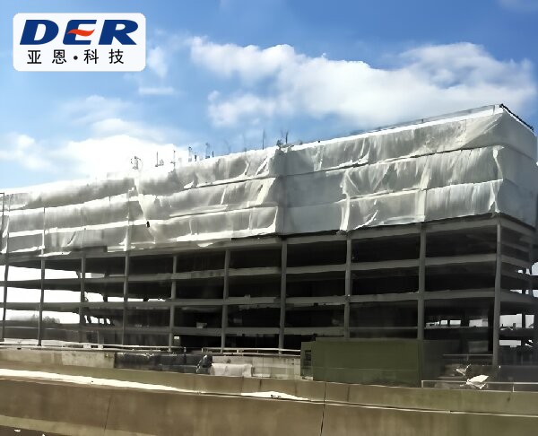 White PVC building site tarp installed around an unfinished structure